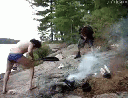 Man and Woman Standing Near Fire