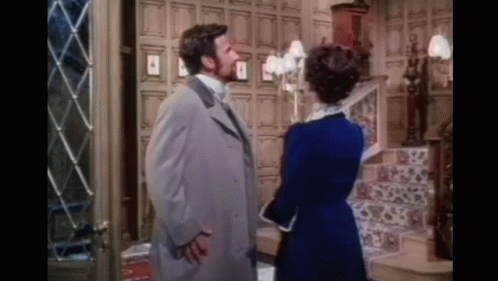 Man And Woman Standing Next To Each Other GIF
