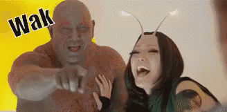Man And Woman Standing Next To Each Other Laughing GIF