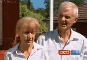 Man And Woman Standing Next To Each Other GIF