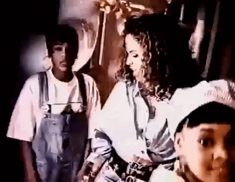 Man And Woman Standing Next To Each Other Woman In Overalls GIF