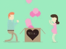 Man and Woman Standing Next to Heart Box