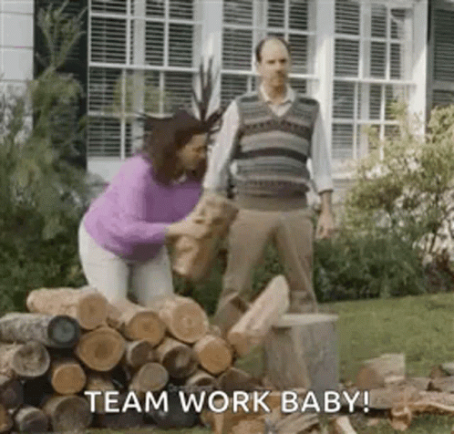 Man And Woman Standing Next To Logs GIF