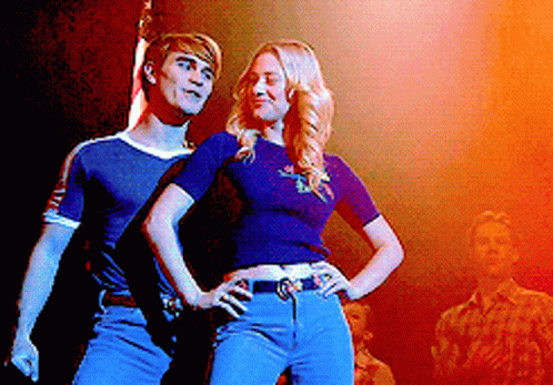 Man And Woman Standing On Stage GIF