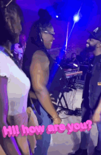 Man And Woman Standing Together In Front Of Stage GIF