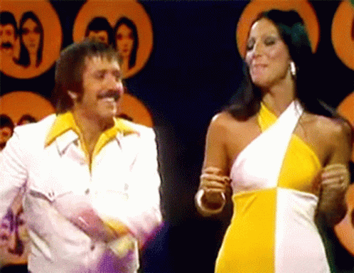 Man and Woman Standing Together on Stage