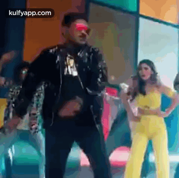 Man And Woman Standing Together On Stage GIF