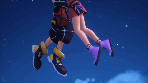 Man And Woman Standing With Legs Crossed GIF