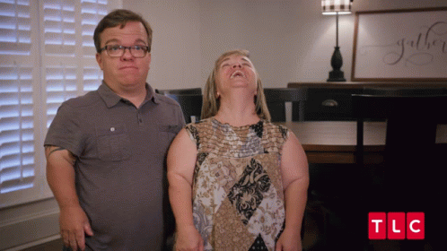 Man and Woman Standing With TLC
