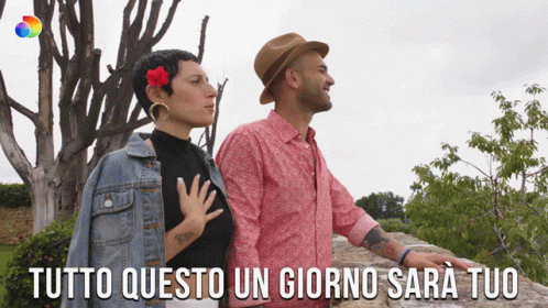 Man And Woman Standing With Tutto Questo Un Giorno Sara Tuo GIF