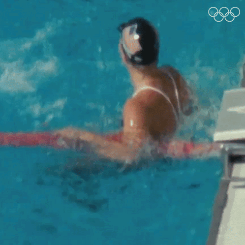 Man and Woman Swimming in Pool