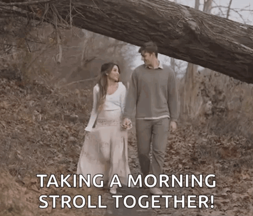 Man and Woman Taking Morning Stroll in Woods