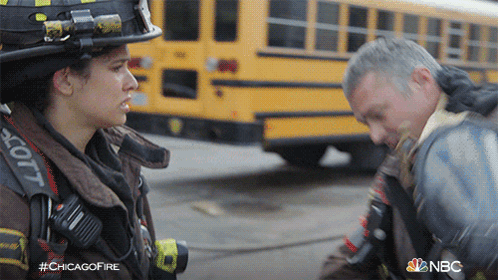 Man And Woman Talking In Front Of Yellow School Bus #Chicagofire GIF