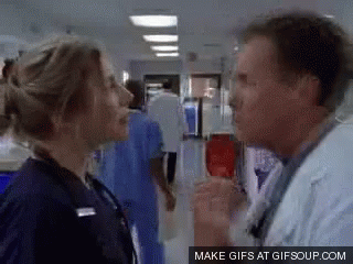Man and Woman Talking in Hallway