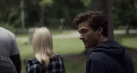 Man And Woman Talking In Park GIF