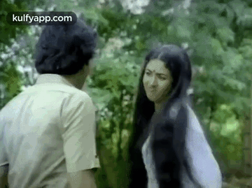 Man and Woman Talking in Woods