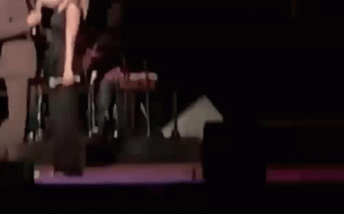 Man and Woman Talking on Stage