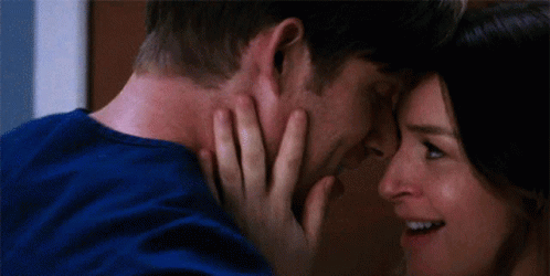 Man and Woman Touching Each Other's Faces and Smiling