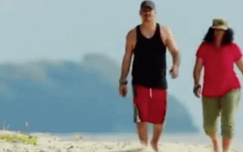 Man and Woman Walking Beach