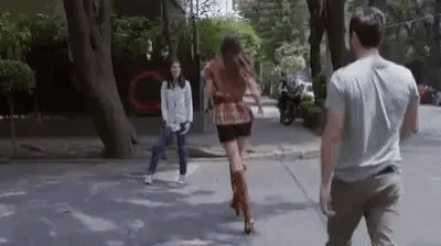 Man And Woman Walking Down Street GIF