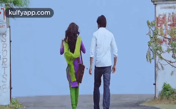 Man And Woman Walking Down Street Kulfyapp.com GIF