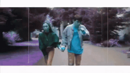 Man and Woman Walking Hand in Hand