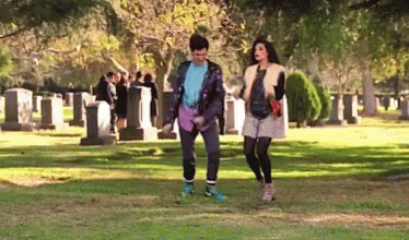 Man and Woman Walking in Cemetery
