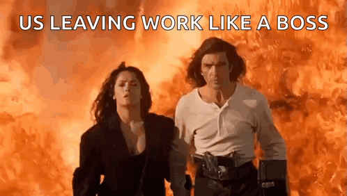 Man and Woman Walking in Front of Fire Us Leaving Work Like a Boss