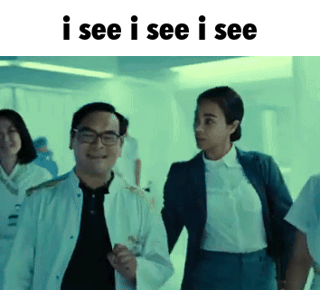 Man and Woman Walking in Hallway