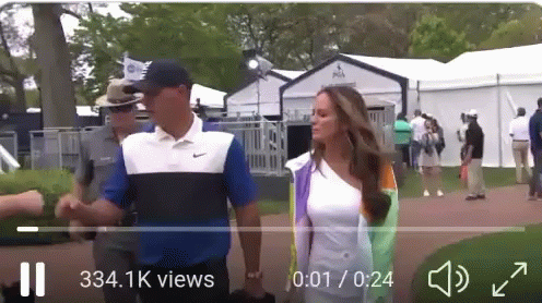 Man and Woman Walking on Golf Course