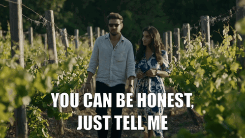 Man and Woman Walking Through Vineyard Saying You Can Be Honest