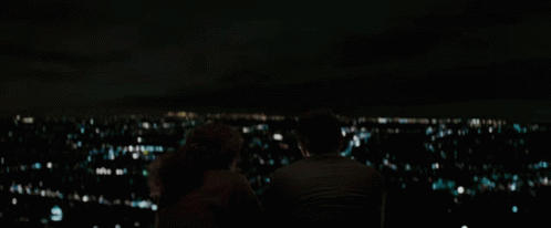 Man and Woman Watching City Lights
