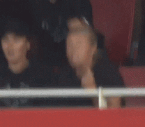 Man and Woman Watching Game
