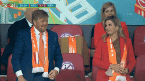 Man And Woman Watching Soccer In Stadium GIF