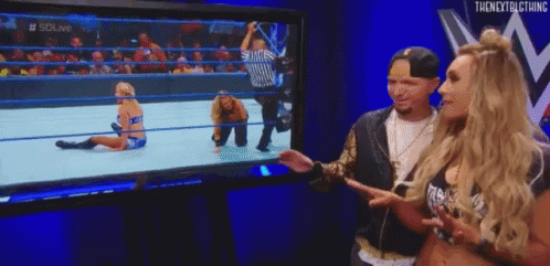 Man and Woman Watching Wrestling