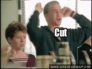 Man and Woman With Arms Up Saying Cut
