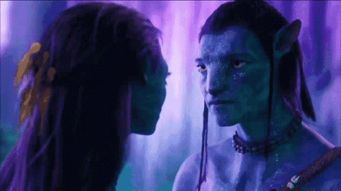 Man and Woman With Blue Painted Faces Looking at Each Other