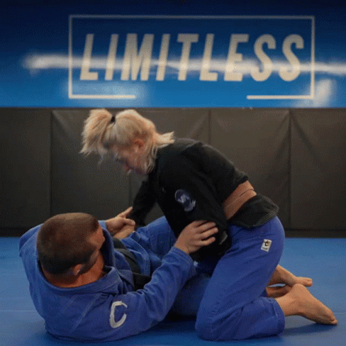 Man and Woman Wrestling Limitless Wall