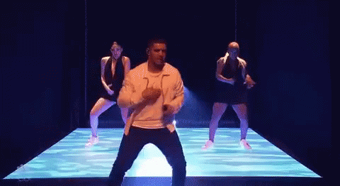 Man and Women Dancing on Stage