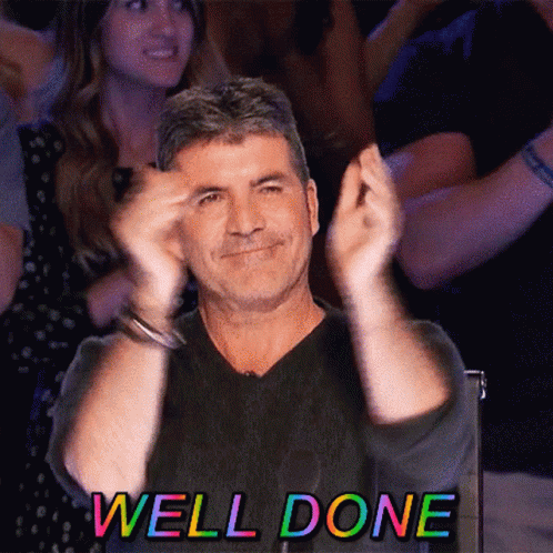 Man Applauding in Front of Crowd Saying Well Done
