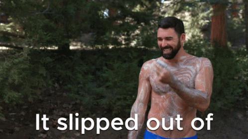 Man Applying Sunscreen With It Slipped Out
