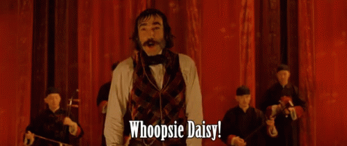 Man Arms Outstretched Saying Whoopsie Daisy Red Curtain