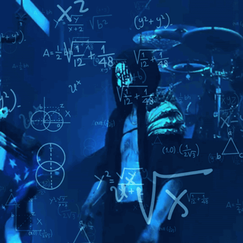 Man at Chalkboard With Math Equations