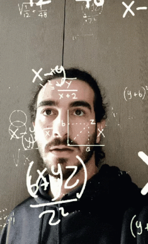 Man at Chalkboard With Math Equations