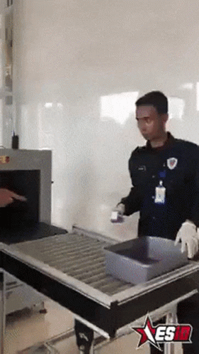 Man at Conveyor Belt With Star Saying Esid