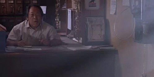 Man at Desk Saying What's Going On