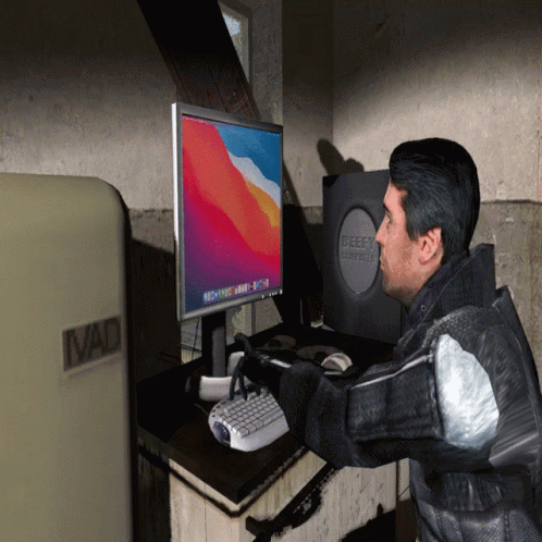Man at Desk With Beefy Computer