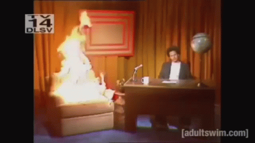 Man at Desk With Fire From Chair
