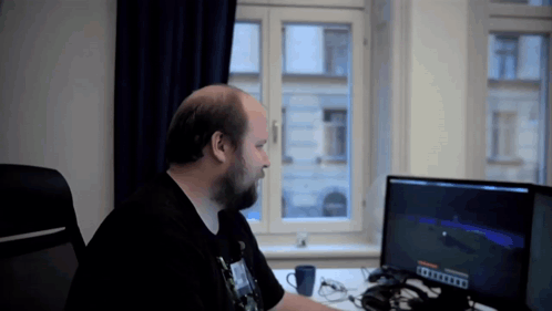 Man at Desk With Minecraft Screen