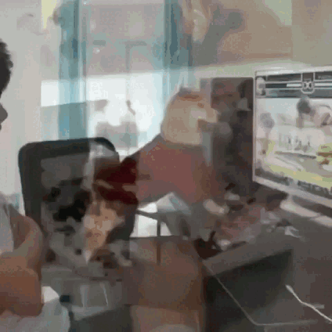 Man at Desk With NFL Screen